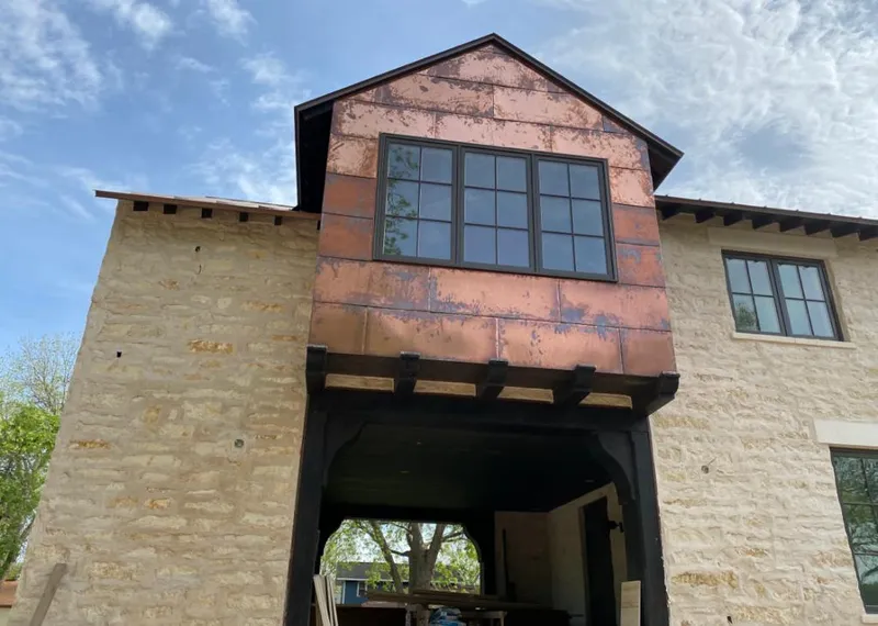 Copper metal panel facade on a stone building for Metal Roof Coating in Princeton